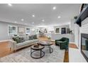 Bright living room with hardwood floors and an open floor plan to the kitchen at 2921 Country Squire Ln, Decatur, GA 30033
