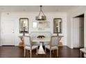 Dining room showcasing modern chandelier, stylish furnishings, and hardwood flooring at 2479 Peachtree Ne Rd # 1805, Atlanta, GA 30305