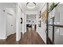 Inviting foyer with dark hardwood floors, modern decor, and views into the living area at 3638 Silvery Way, Powder Springs, GA 30127