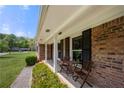 Inviting front porch with outdoor seating, perfect for relaxing and enjoying the neighborhood view at 690 Manor Ridge Sw Dr, Mableton, GA 30126