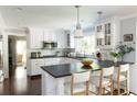 Charming kitchen with white cabinets, granite counters, stainless steel appliances, and hardwood floors at 540 Cambridge Way, Atlanta, GA 30328