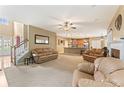 Open-concept living room with fireplace and seamless flow into the adjacent kitchen at 150 Fitzroy Ln, Acworth, GA 30101