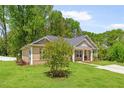 Beautiful single-Gathering home with a landscaped yard, cozy front porch, and inviting curb appeal set amid lush greenery at 8405 Military Way, Douglasville, GA 30134