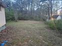 Spacious backyard with room for activities, edged by mature trees at , Stockbridge, GA 30281