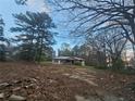 Distant view of a charming brick home nestled among the trees at , Stockbridge, GA 30281