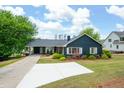 Inviting home with mature trees, landscaped lawn, and convenient covered parking at 2155 Old Dallas Rd, Marietta, GA 30064