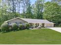 Charming single-story home boasting a manicured lawn, beautiful landscaping, and an attached two-car garage at 4307 Smithsonia Ct, Tucker, GA 30084