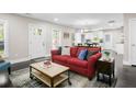 Inviting living room with dark floors, bright walls, an area rug and stylish furniture at 1084 Regent Sw St, Atlanta, GA 30310
