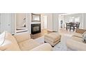Cozy living room featuring neutral walls, a fireplace, and hardwood floors at 200 High Creek Dr, Roswell, GA 30076