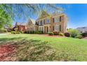 A beautiful brick home with lush green lawn and landscape, creating a welcoming curb appeal at 562 Grassmeade Way, Snellville, GA 30078