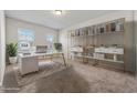 Well-lit home office featuring a modern desk, stylish shelving, and a comfortable workspace at 1543 Dover Creek Ln, Lawrenceville, GA 30045