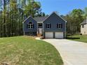 Inviting two-story home with a spacious front yard and a two-car garage at 202 Gamel Rd, Dallas, GA 30157