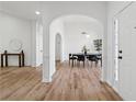 Elegant dining area with hardwood floors, a modern chandelier, and an open layout that is perfect for entertaining at 290 Magnolia Walk Ln, Atlanta, GA 30349
