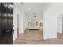 Inviting living room with light hardwood floors, white walls, a fireplace, and an open, airy layout at 290 Magnolia Walk Ln, Atlanta, GA 30349