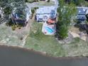 Stunning aerial view of the home featuring a pool and waterfront access on a large lot at 140 N Lakeside Nw Dr, Kennesaw, GA 30144
