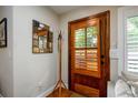 Mud room featuring a decorative mirror and wooden door with shuttered glass at 2724 Parkwood Se Rd, Smyrna, GA 30080