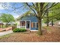 Inviting blue home featuring a cozy porch with wooden shutters at 650 Ira Sw St, Atlanta, GA 30312
