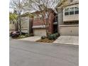 Charming brick townhouse with an attached garage and well-maintained landscaping at 2250 W Village Junction Se Way, Smyrna, GA 30080
