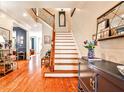 Welcoming foyer featuring hardwood floors, staircase, and decorative accents at 2250 W Village Junction Se Way, Smyrna, GA 30080