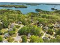 Community aerial view highlighting lake and lush greenery at 3015 Larkspur Ct, Cumming, GA 30041