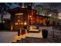 Eye-catching exterior with landscape lighting, a brick facade, and a modern walkway at 151 Rockmart Dr Sw, Atlanta, GA 30314