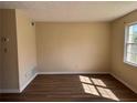A clean, well lit bedroom with ample natural light and laminate flooring at 501 Carlton Rd # 5E, Palmetto, GA 30268