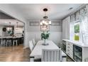 Bright dining room featuring modern chandelier, decor, and natural light at 7001 Palomino Trl, Winston, GA 30187