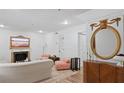 Living room featuring a fireplace, light colored walls, ornate mirror and contemporary furnishings at 3147 Buford Ne Hwy # 8, Brookhaven, GA 30329