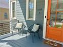 Inviting front porch with seating, painted siding, and a brightly painted front door at 1100 Wylie Se St # A, Atlanta, GA 30316