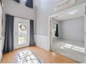 Bright foyer with hardwood floors, soaring ceilings, and views into adjoining rooms at 419 Farmwood Way, Canton, GA 30115