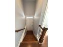 Welcoming entryway featuring hardwood floors and stairs leading to the upper level at 4487 Kerrington Ave, Sugar Hill, GA 30518
