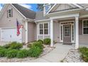 Charming single-story home with attached garage and well-manicured landscaping around the front porch at 4960 Shannon Sw Way, Mableton, GA 30126