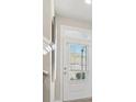 Bright entryway with a white door with glass, offering a welcoming transition into the home at 1041 Cherryfield Run, Marietta, GA 30008