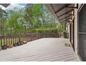 Spacious outdoor deck for relaxing and entertaining amidst a tranquil wooded setting at 2972 Nw Stilesboro Nw Rd, Kennesaw, GA 30152