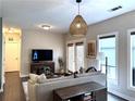 Comfortable living room with hardwood floors, neutral decor, and access to a balcony at 35 Moda Ln, Atlanta, GA 30316