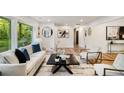 Bright living room with large windows, contemporary decor, and open layout for entertaining at 2685 Glenvalley Dr, Decatur, GA 30032
