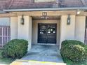Apartment building entrance with double doors, building number, and exterior lanterns at 3038 Parc Lorraine, Lithonia, GA 30038