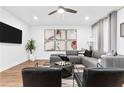 A spacious living room featuring a comfortable gray sectional and modern decor at 388 Pratt Se Dr # 2123, Atlanta, GA 30315