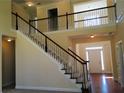 Bright foyer with staircase and beautiful railing, leading to the upper level of this spacious home at 533 Mount Gerizim Se Rd, Mableton, GA 30126