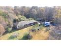 A ranch-style home with a brick facade, a PODS moving container, and a spacious lot at 98 Almon Church Rd, Covington, GA 30014