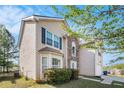 View of two story home with beige siding and stone entryway at 3243 Timber Rdg, College Park, GA 30349