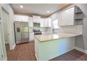 Modern kitchen with stainless steel appliances, granite countertops, and white cabinetry perfect for cooking at 191 Fairview Oak Trl, Dallas, GA 30157