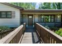 Inviting front entrance with accessible ramp, lovely flowers, and space for outdoor decor at 2920 Dara Dr, Marietta, GA 30066