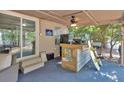 The outdoor bar area includes a custom-built bar with a sink, ice maker and an adjacent seating area at 5400 Kings Camp Cabin 16 Se Rd, Acworth, GA 30102