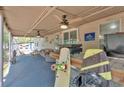 A covered patio features a bar with seating, outdoor furniture, and views of the lake at 5400 Kings Camp Cabin 16 Se Rd, Acworth, GA 30102