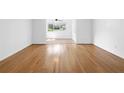 Open-concept living space boasts light hardwood floors and abundant natural light at 1468 Briarwood Ne Rd # 602, Atlanta, GA 30319