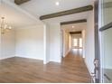 Bright living room features wood floors and exposed beam ceilings at 5325 Keepsake Court, Cumming, GA 30040