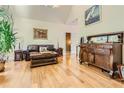 Spacious living area featuring hardwood floors, comfortable leather seating, and stylish decor at 1872 Lake Lucerne Sw Dr, Lilburn, GA 30047