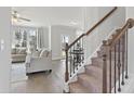 Open-concept living area featuring a staircase, living room and breakfast nook with lots of natural light at 545 Paces Dr, Lithia Springs, GA 30122