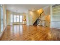 Open concept living area boasting gleaming hardwood floors, staircase and bright windows at 774 Piedmont Ne Ave # 11B, Atlanta, GA 30308